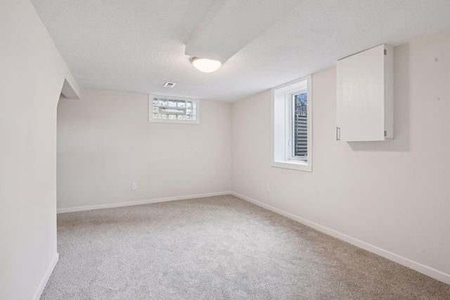 1650 Sherburne Ave, Saint Paul, MN 55104 - basement with carpet, baseboards, and a textured ceiling