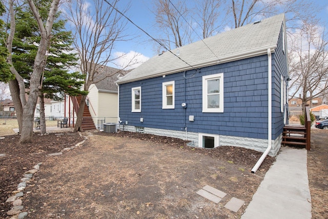 1650 Sherburne Ave, Saint Paul, MN 55104 - back of house featuring fence, roof with shingles, and central AC