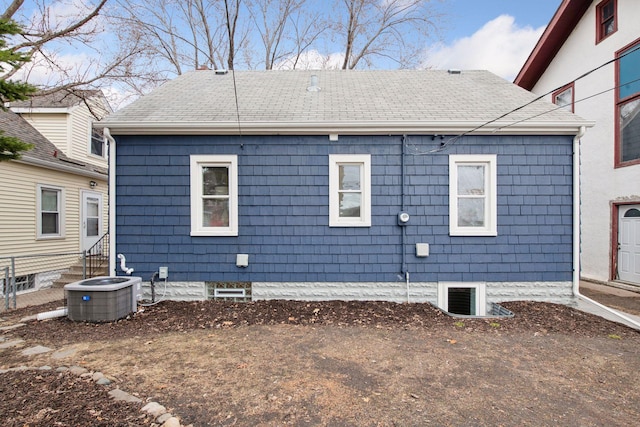 1650 Sherburne Ave, Saint Paul, MN 55104 - rear view of property with central air condition unit, entry steps, and roof with shingles
