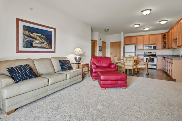 living room featuring dark carpet