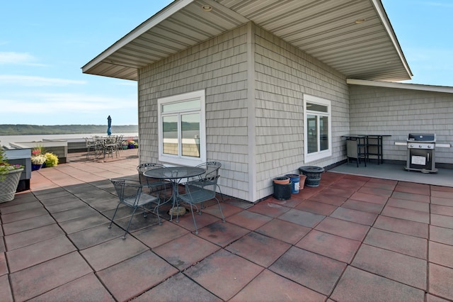view of patio with grilling area and outdoor dining area