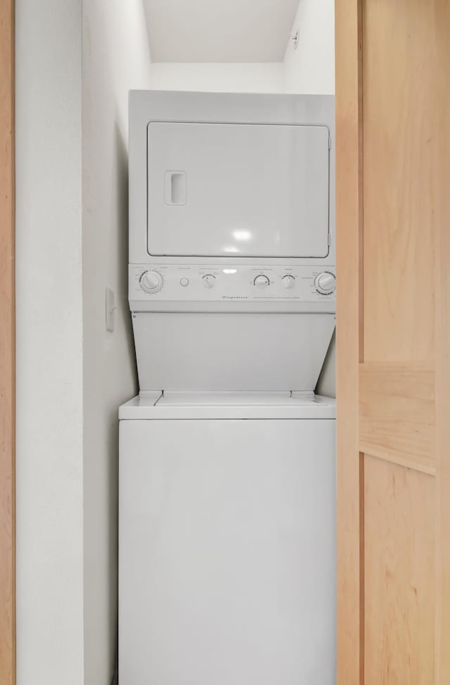 1215 Lakeshore Dr Unit 207, Lake City, MN 55041 - clothes washing area with stacked washing machine and dryer