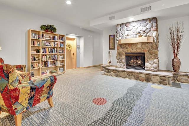 1215 Lakeshore Dr Unit 207, Lake City, MN 55041 - sitting room featuring a stone fireplace, carpet flooring, recessed lighting, and baseboards