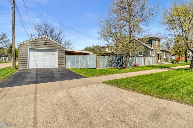 101 5th St NE, Barnesville, MN 56514 - view of home's exterior with asphalt driveway and a garage