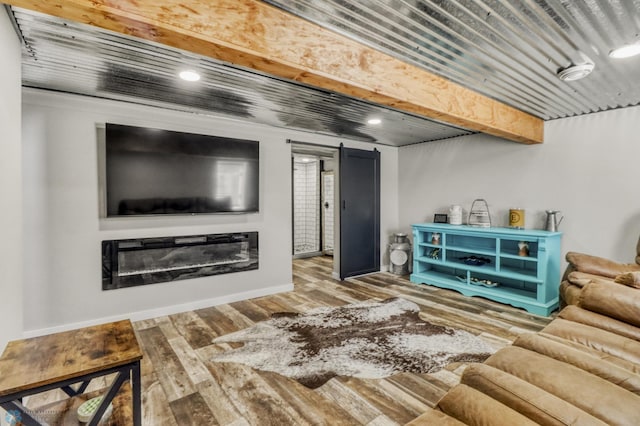 101 5th St NE, Barnesville, MN 56514 - living area featuring wood finished floors, baseboards, recessed lighting, and a glass covered fireplace