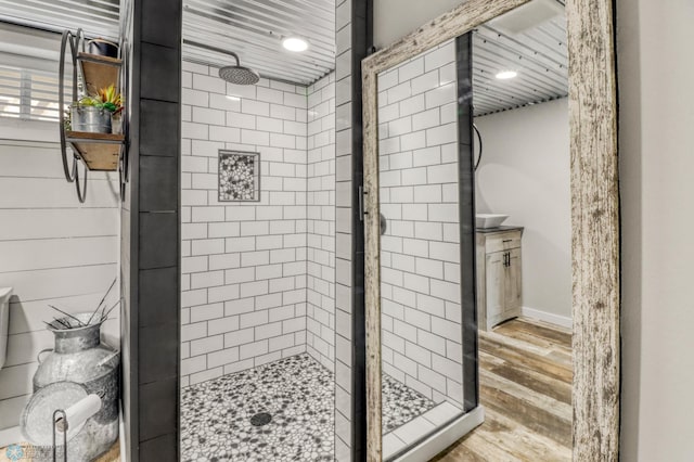 101 5th St NE, Barnesville, MN 56514 - bathroom featuring a shower stall, wood finished floors, and baseboards