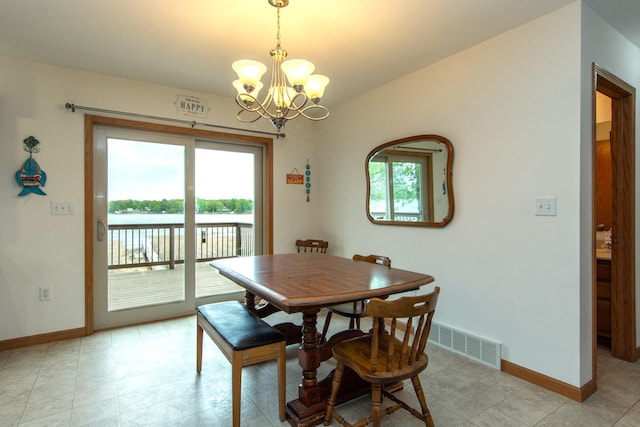 1900 White Cloud Dr E, Isle, MN 56342 - dining space featuring a chandelier and baseboards