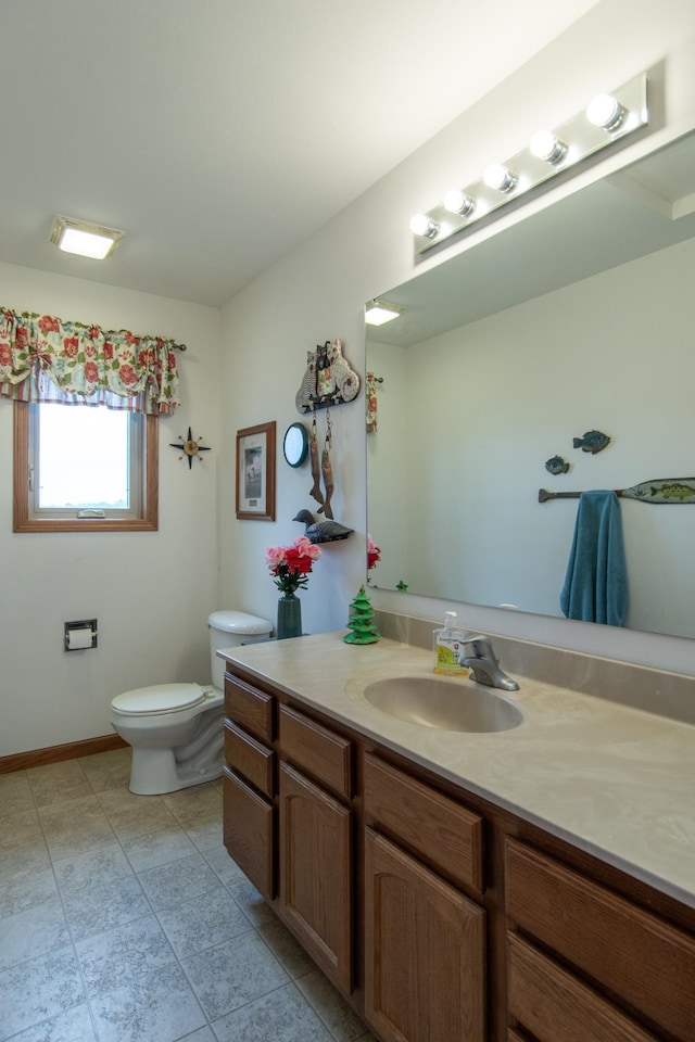 1900 White Cloud Dr E, Isle, MN 56342 - bathroom with toilet, vanity, and tile patterned flooring