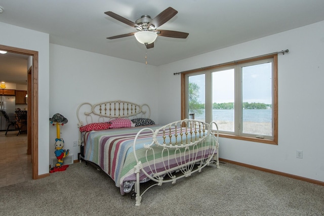 1900 White Cloud Dr E, Isle, MN 56342 - carpeted bedroom featuring freestanding refrigerator, baseboards, a water view, and ceiling fan