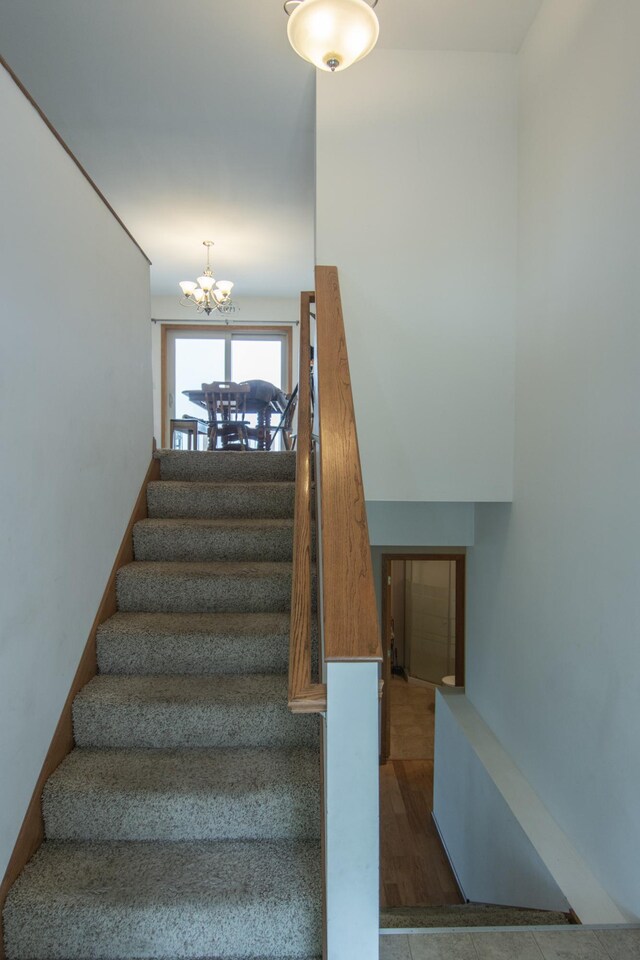 1900 White Cloud Dr E, Isle, MN 56342 - staircase with a chandelier and wood finished floors