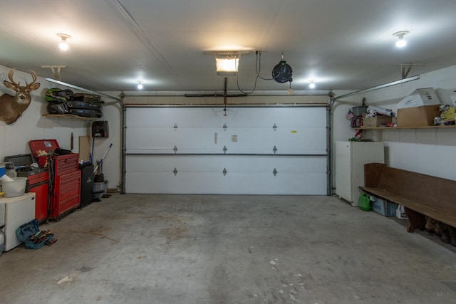 1900 White Cloud Dr E, Isle, MN 56342 - garage with freestanding refrigerator