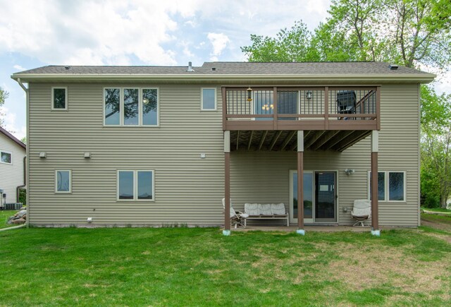 1900 White Cloud Dr E, Isle, MN 56342 - back of house featuring a lawn, a patio, cooling unit, and a deck