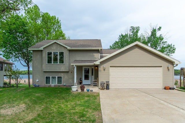 1900 White Cloud Dr E, Isle, MN 56342 - tri-level home featuring an attached garage, driveway, a front yard, and roof with shingles