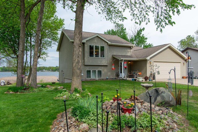 1900 White Cloud Dr E, Isle, MN 56342 - split level home with an attached garage, a front lawn, driveway, and a water view