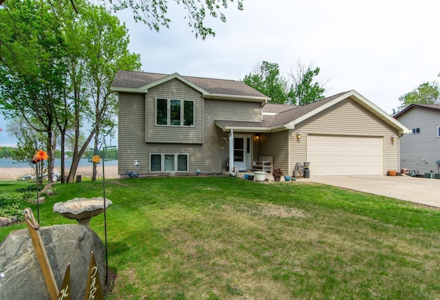 1900 White Cloud Dr E, Isle, MN 56342 - tri-level home featuring a garage, driveway, a front yard, and a shingled roof