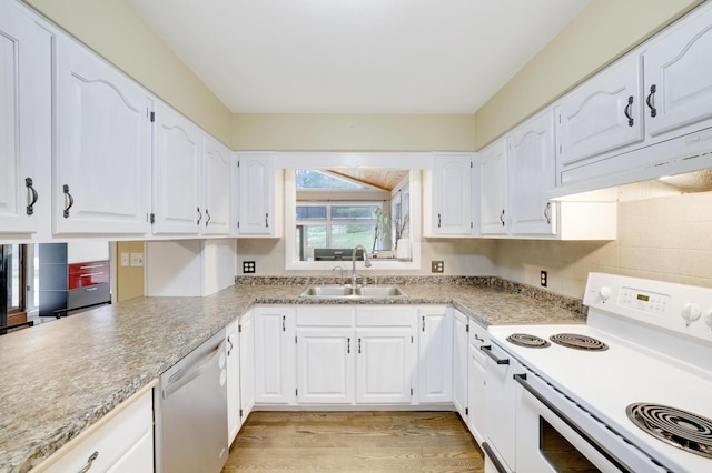 W12798 State Road 35, Prescott, WI 54021 - kitchen with white range with electric stovetop, stainless steel dishwasher, a sink, under cabinet range hood, and white cabinets