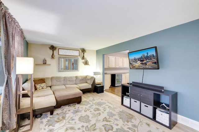 W12798 State Road 35, Prescott, WI 54021 - living area featuring beverage cooler and light wood-style flooring