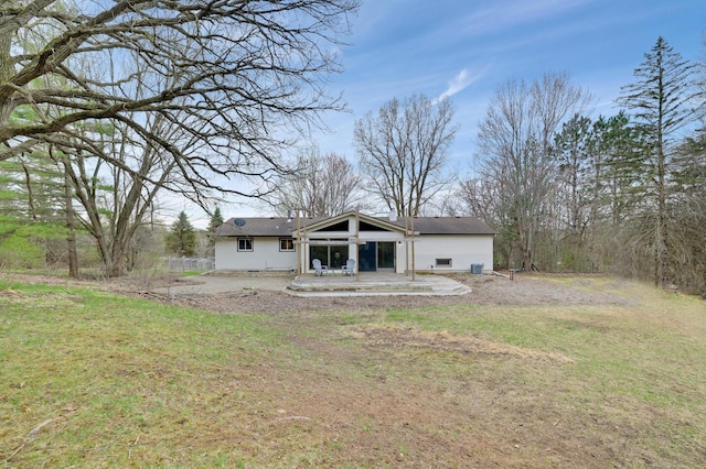 W12798 State Road 35, Prescott, WI 54021 - rear view of property with a patio area and a lawn