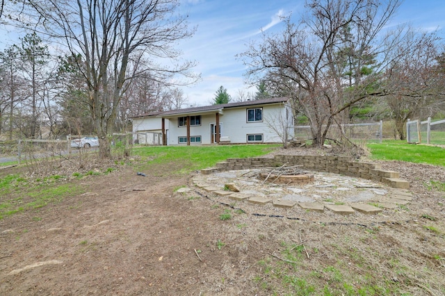 W12798 State Road 35, Prescott, WI 54021 - back of property featuring fence and an outdoor fire pit