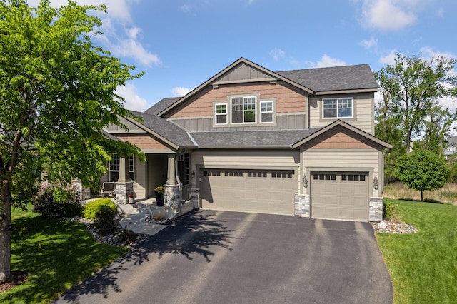 3742 Crane Island Ct, Minnetrista, MN 55331 - craftsman-style house with board and batten siding, asphalt driveway, a garage, stone siding, and a front lawn