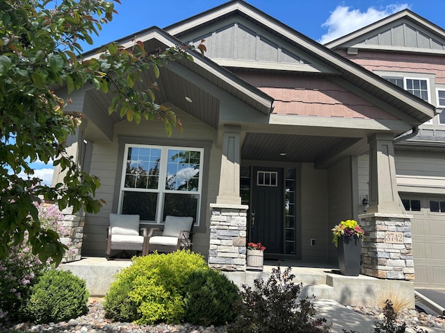 3742 Crane Island Ct, Minnetrista, MN 55331 - view of front facade featuring covered porch and stone siding