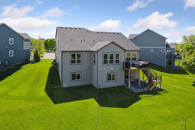 3742 Crane Island Ct, Minnetrista, MN 55331 - rear view of house with stairway, a wooden deck, central AC, and a yard