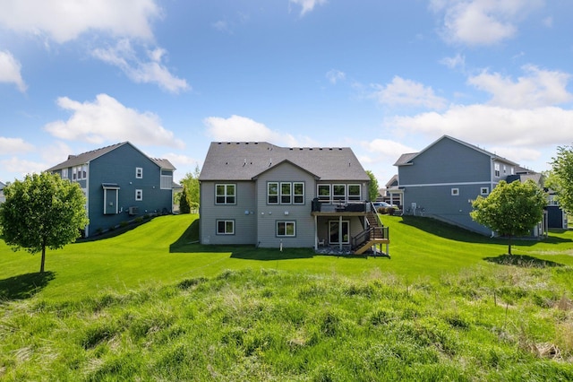 3742 Crane Island Ct, Minnetrista, MN 55331 - rear view of property featuring stairs, a wooden deck, and a lawn
