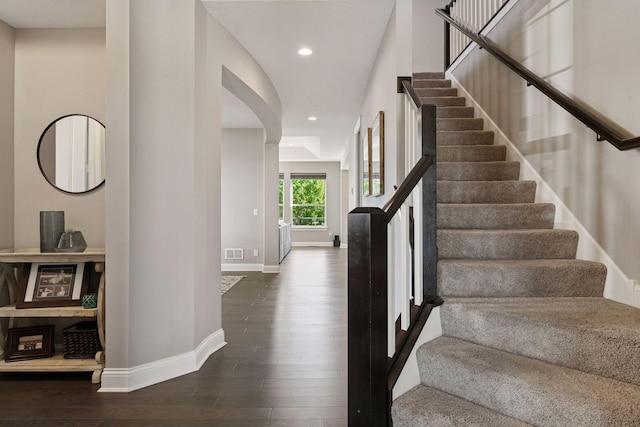 3742 Crane Island Ct, Minnetrista, MN 55331 - staircase with baseboards, wood finished floors, recessed lighting, and arched walkways