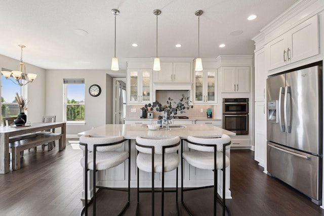 3742 Crane Island Ct, Minnetrista, MN 55331 - kitchen with stainless steel appliances, light countertops, decorative backsplash, dark wood finished floors, and white cabinets