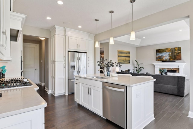 3742 Crane Island Ct, Minnetrista, MN 55331 - kitchen with stainless steel appliances, a sink, dark wood-style flooring, white cabinets, and recessed lighting