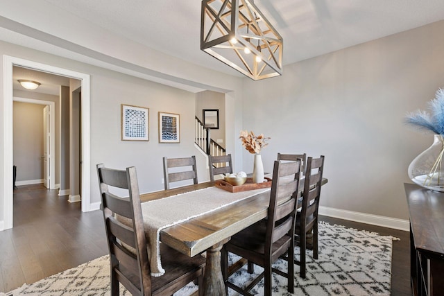 3742 Crane Island Ct, Minnetrista, MN 55331 - dining room with a chandelier, wood finished floors, stairway, and baseboards