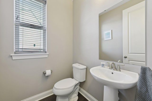3742 Crane Island Ct, Minnetrista, MN 55331 - half bathroom with baseboards, toilet, and a sink