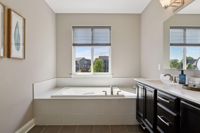 3742 Crane Island Ct, Minnetrista, MN 55331 - full bath featuring a garden tub, vanity, and wood finished floors
