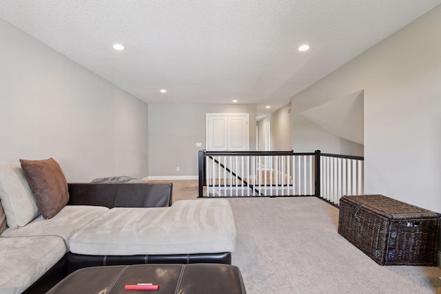 3742 Crane Island Ct, Minnetrista, MN 55331 - sitting room with carpet flooring, recessed lighting, baseboards, an upstairs landing, and a textured ceiling