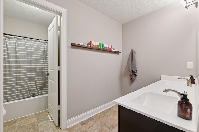 3742 Crane Island Ct, Minnetrista, MN 55331 - full bath with a textured ceiling, double vanity, and shower / tub combo