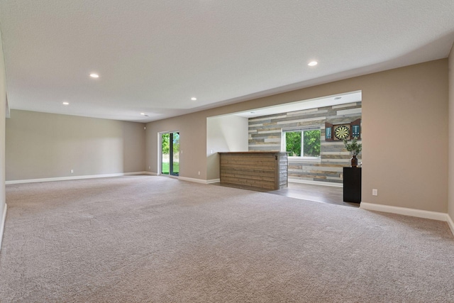 3742 Crane Island Ct, Minnetrista, MN 55331 - unfurnished living room with carpet, baseboards, and recessed lighting