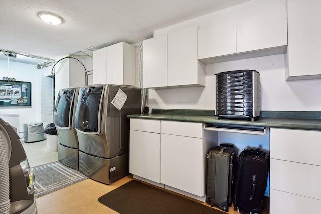 laundry room with washer and dryer and cabinet space