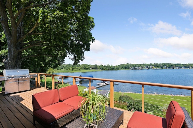 wooden terrace featuring a water view, outdoor lounge area, and area for grilling