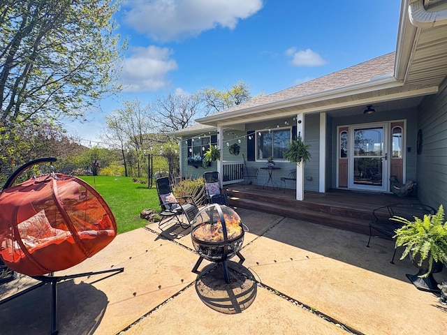view of patio / terrace featuring an outdoor fire pit and covered porch