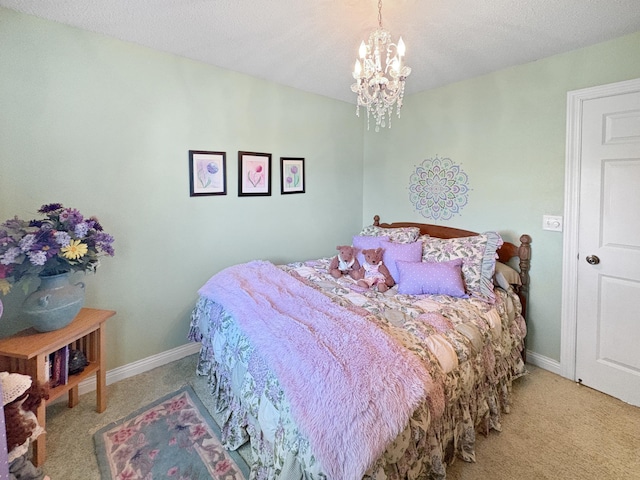 bedroom with carpet, a chandelier, baseboards, and a textured ceiling