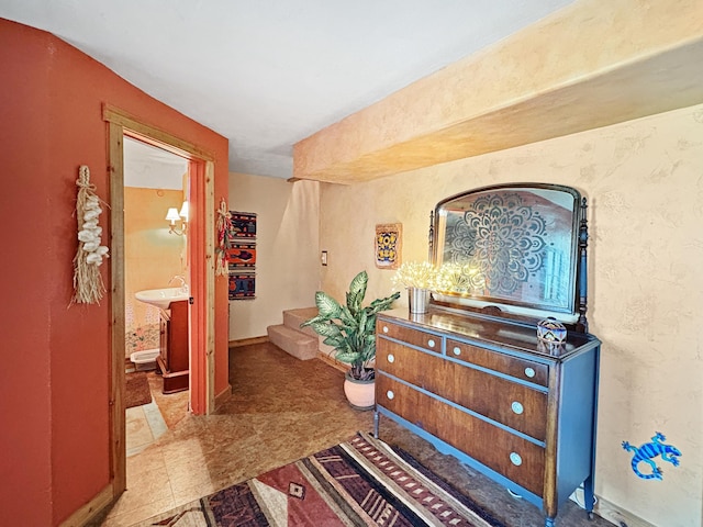 hallway with stairs and baseboards