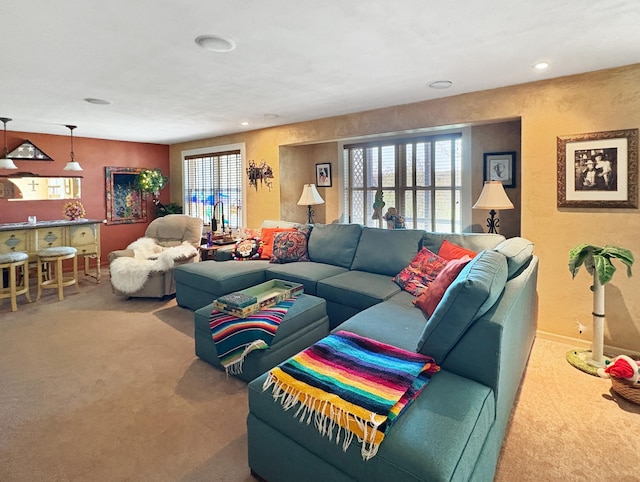 living room featuring carpet floors, plenty of natural light, and recessed lighting