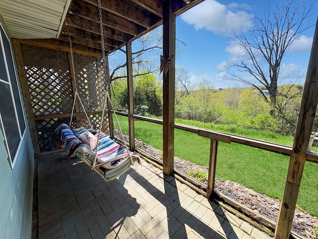 wooden deck with a lawn
