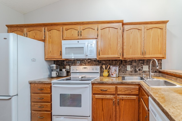 17081 Pheasant Meadow Ln SW, Prior Lake, MN 55372 - kitchen featuring white appliances, a sink, vaulted ceiling, decorative backsplash, and light countertops