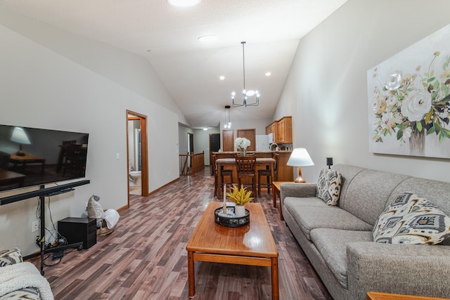 17081 Pheasant Meadow Ln SW, Prior Lake, MN 55372 - living area with wood finished floors, a chandelier, vaulted ceiling, and baseboards