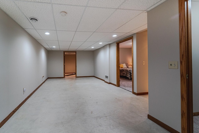17081 Pheasant Meadow Ln SW, Prior Lake, MN 55372 - spare room with baseboards, concrete floors, a drop ceiling, recessed lighting, and a smoke detector