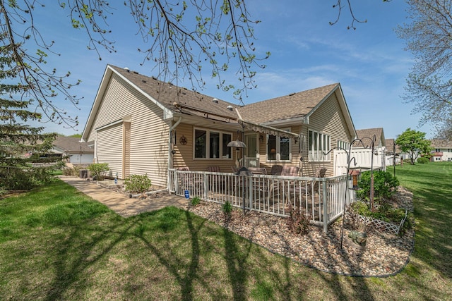 17081 Pheasant Meadow Ln SW, Prior Lake, MN 55372 - rear view of property featuring a yard, a deck, and roof with shingles