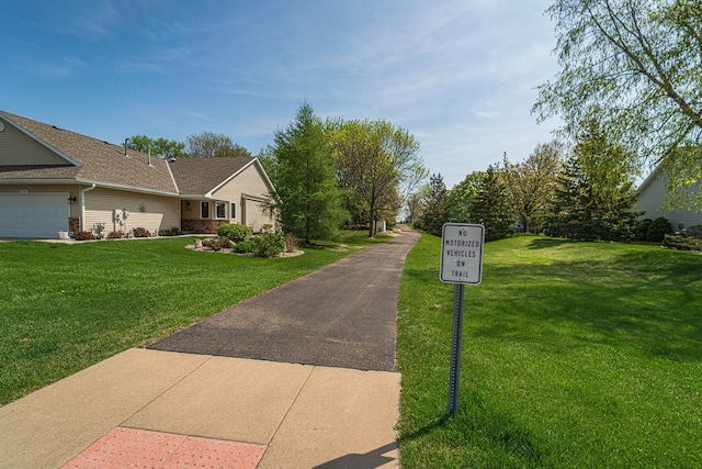 17081 Pheasant Meadow Ln SW, Prior Lake, MN 55372 - exterior space with a yard, a garage, and roof with shingles