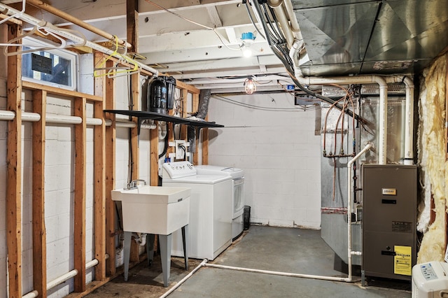 7349 Variolite Dr NW, Stanford Twp, MN 55398 - unfinished basement with washer and clothes dryer, concrete block wall, and a sink