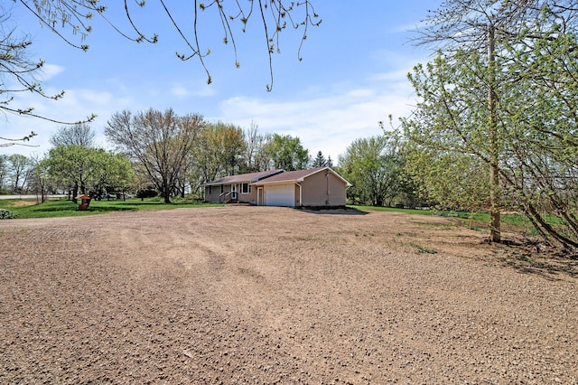 7349 Variolite Dr NW, Stanford Twp, MN 55398 - view of yard with a garage and dirt driveway